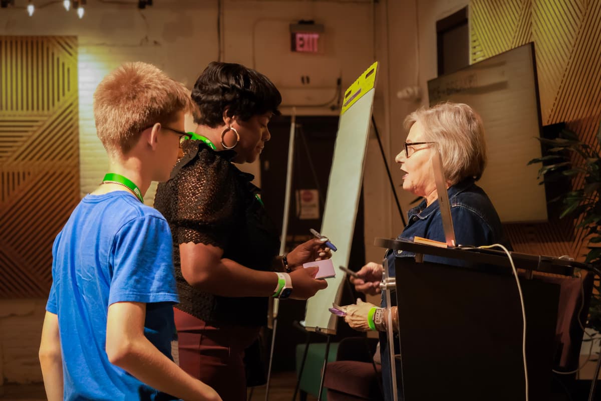 Mentors engaging with a founder team.