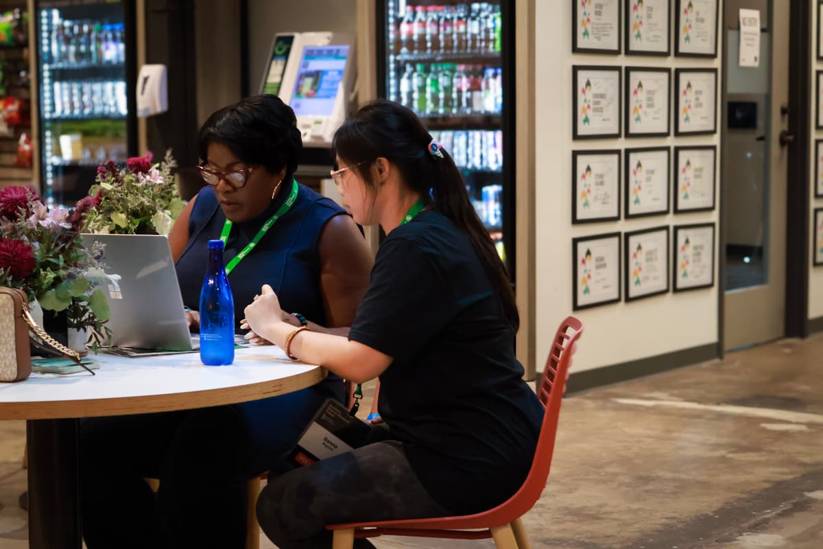 Startup teams working through product demos.