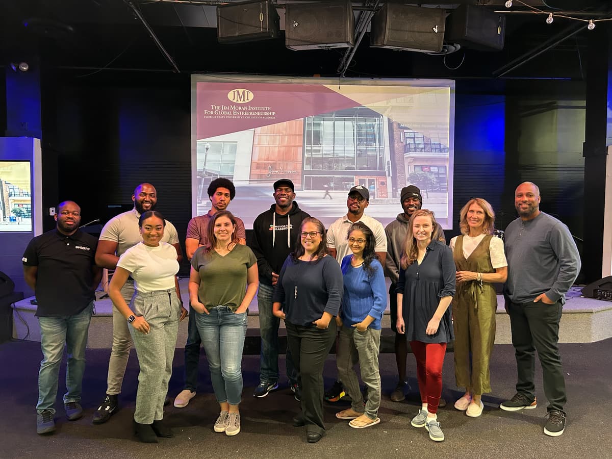 Underrepresented founders sharing progress during a weekly stand‑up.